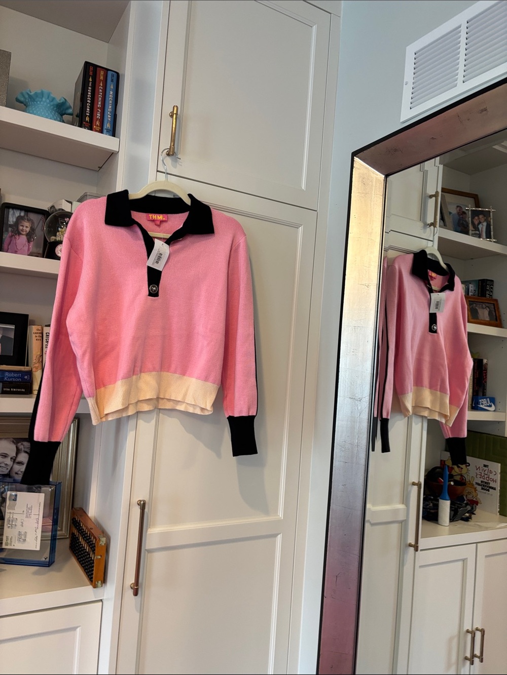 THML Pink V‑Neck Polo Sweater with Black Trim and Cream Hem
